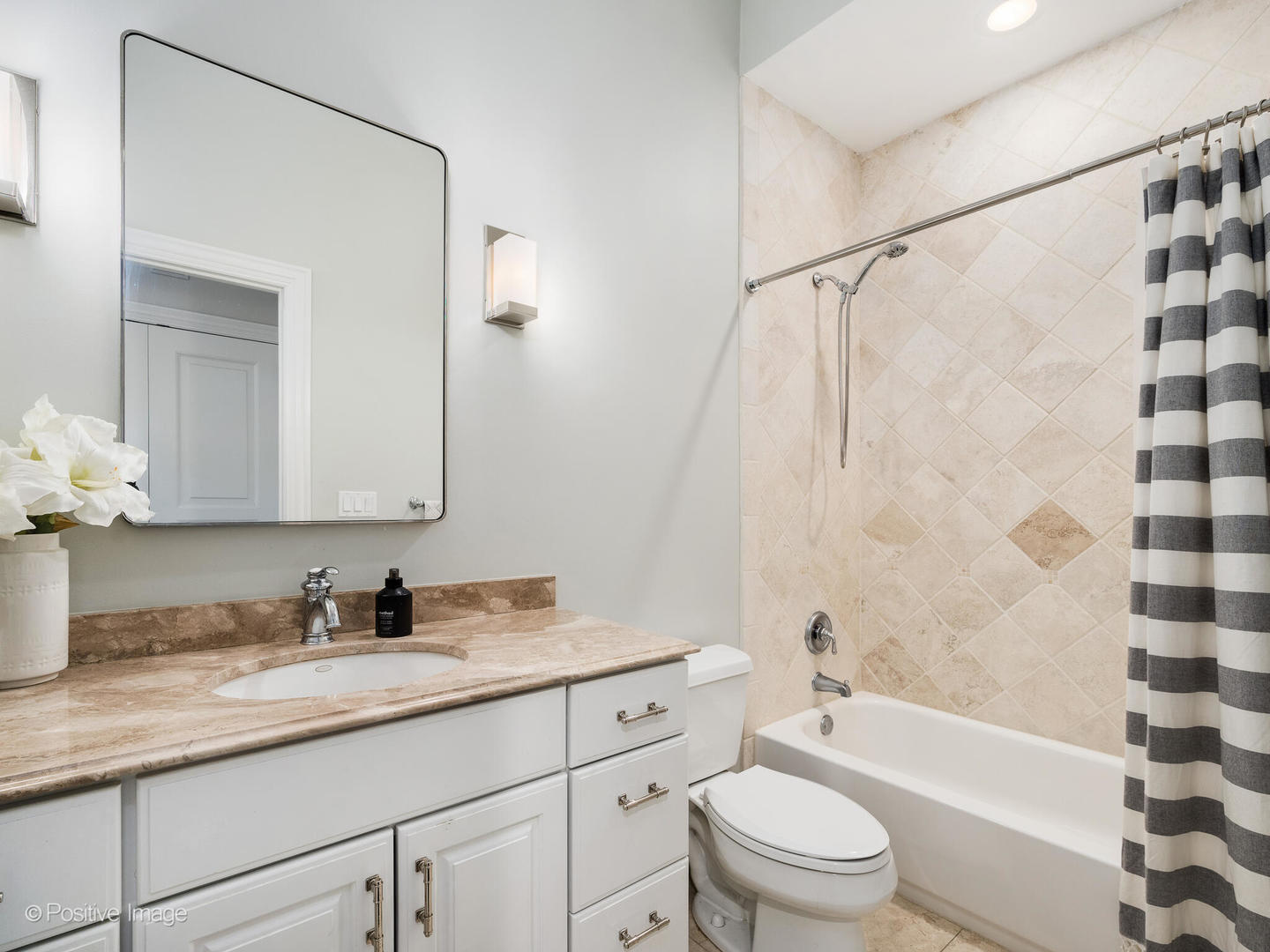 1359 West Fullerton Avenue, Unit PH Chicago, IL 60614 - Photo 23 of 33 a bathroom with a granite countertop sink toilet a shower and a mirror