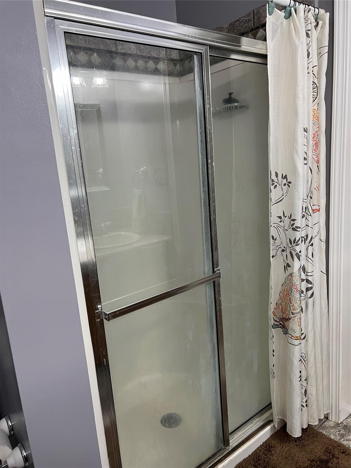 314 Windy Ridge Drive Rutherfordton, NC 28139 - Photo 23 of 46 a bathroom with a glass shower door