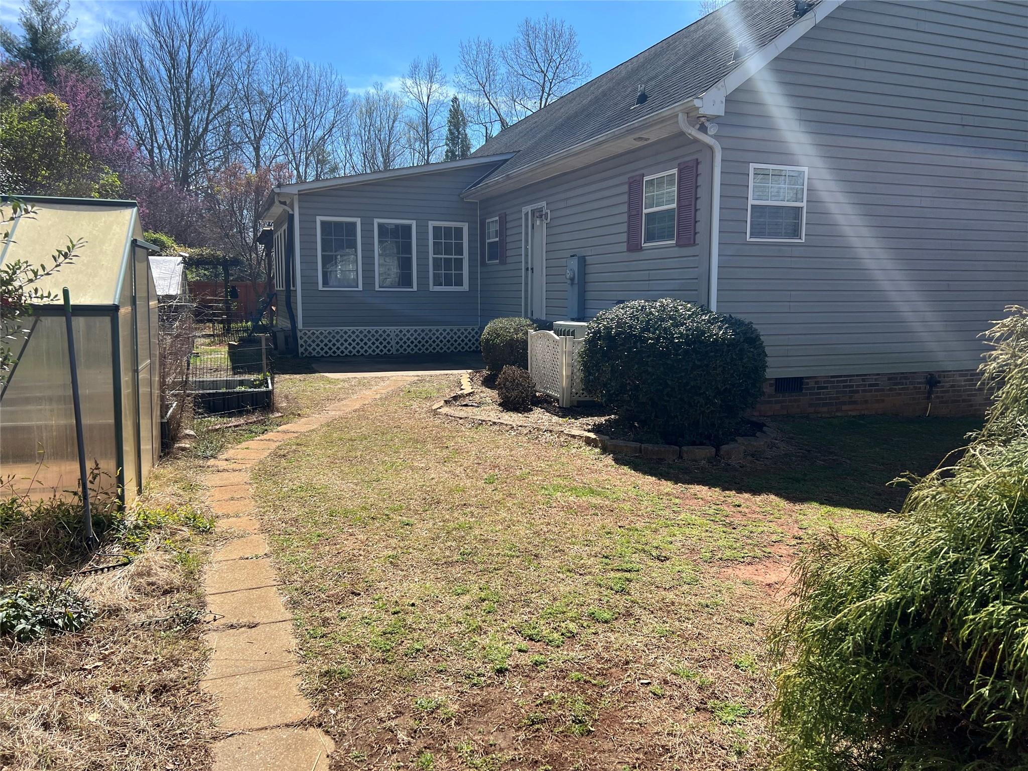 314 Windy Ridge Drive Rutherfordton, NC 28139 - Photo 34 of 46 a backyard of a house with yard and outdoor seating