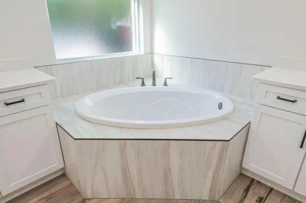 a en suite bathroom with a double vanity sink a mirror and a shower