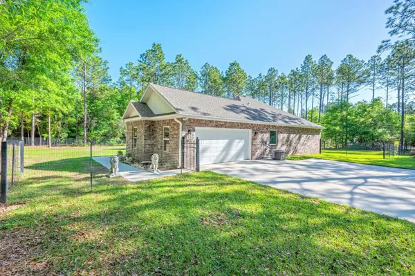 a view of a house with a yard porch and sitting area
