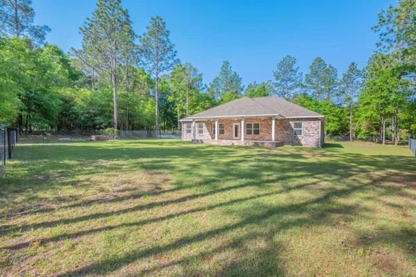 a view of a house with a big yard
