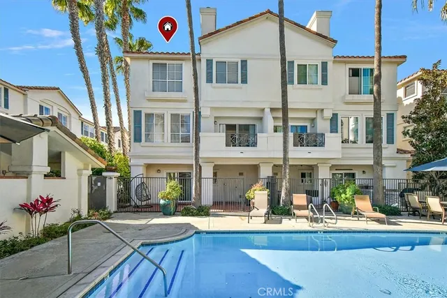 a front view of a house with swimming pool