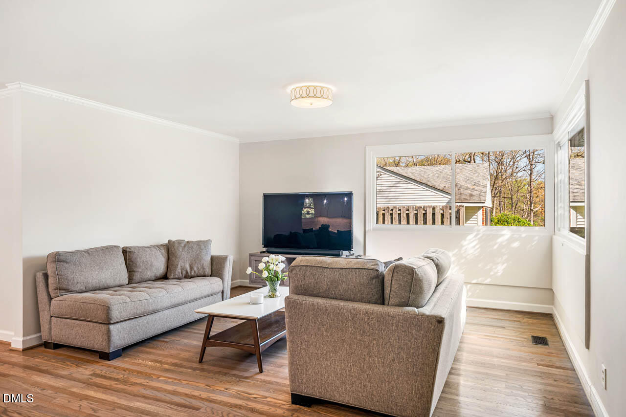 231 Flemington Road Chapel Hill, NC 27517 - Photo 10 of 43 a living room with furniture and a flat screen tv
