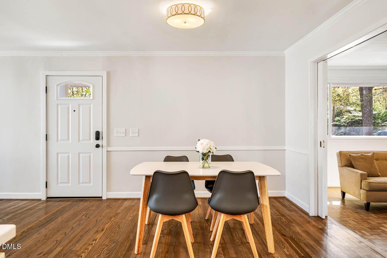 231 Flemington Road Chapel Hill, NC 27517 - Photo 11 of 43 a view of a dining room with furniture and wooden floor