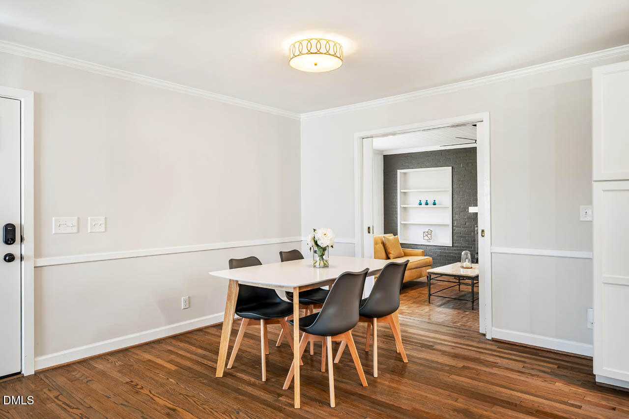 231 Flemington Road Chapel Hill, NC 27517 - Photo 12 of 43 a view of a dining room with furniture and wooden floor