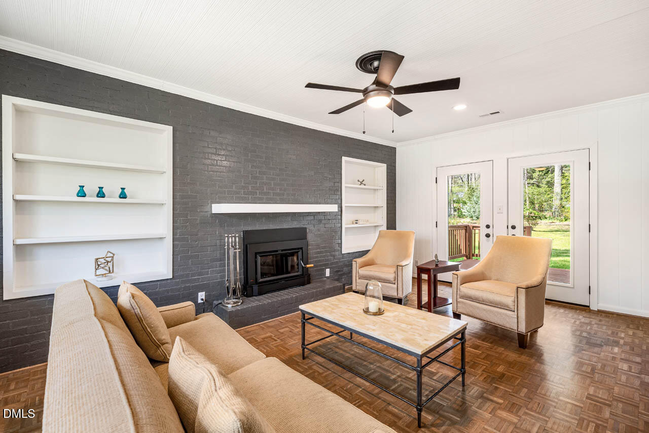 231 Flemington Road Chapel Hill, NC 27517 - Photo 16 of 43 a living room with furniture and a fireplace