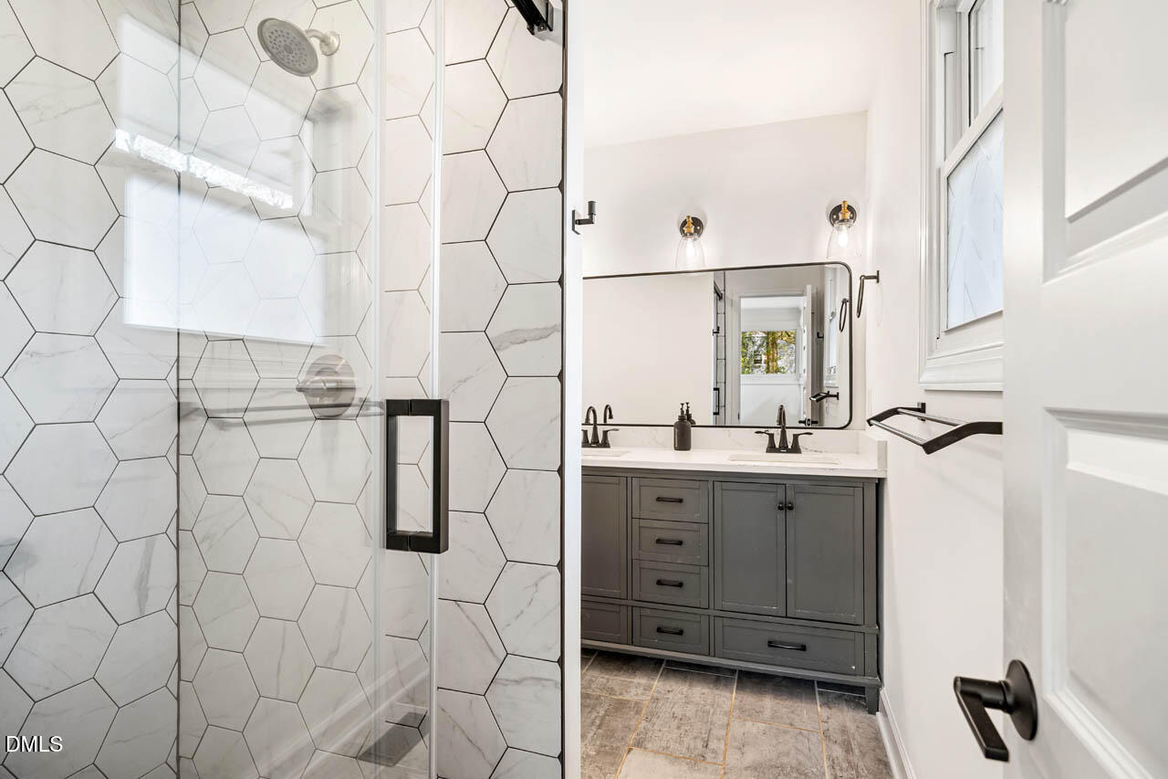 231 Flemington Road Chapel Hill, NC 27517 - Photo 20 of 43 a bathroom with a sink and mirror