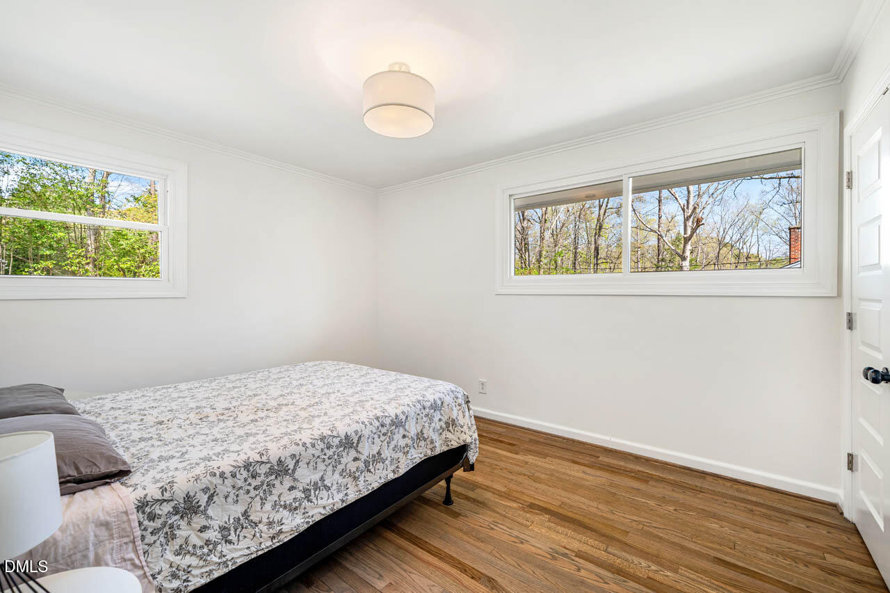 231 Flemington Road Chapel Hill, NC 27517 - Photo 24 of 43 a bedroom with a bed and a window