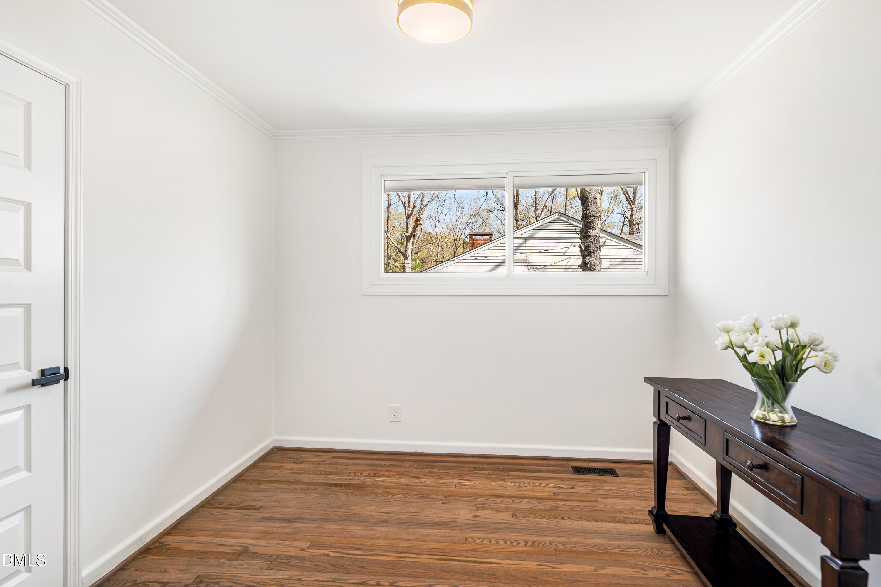 231 Flemington Road Chapel Hill, NC 27517 - Photo 27 of 43 a view of room with window and wooden floor