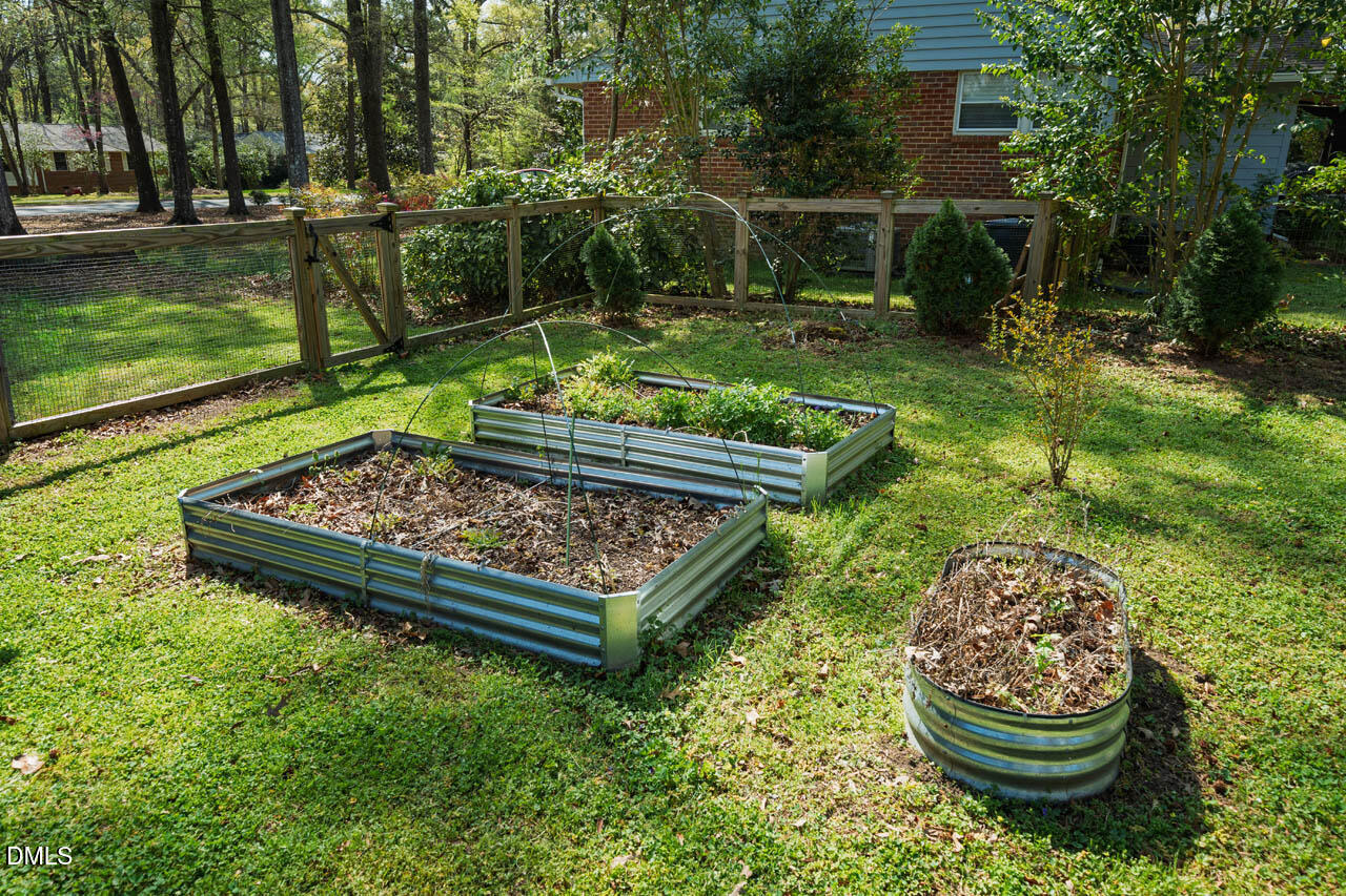 231 Flemington Road Chapel Hill, NC 27517 - Photo 37 of 43 a wooden bench sitting in the middle of a park