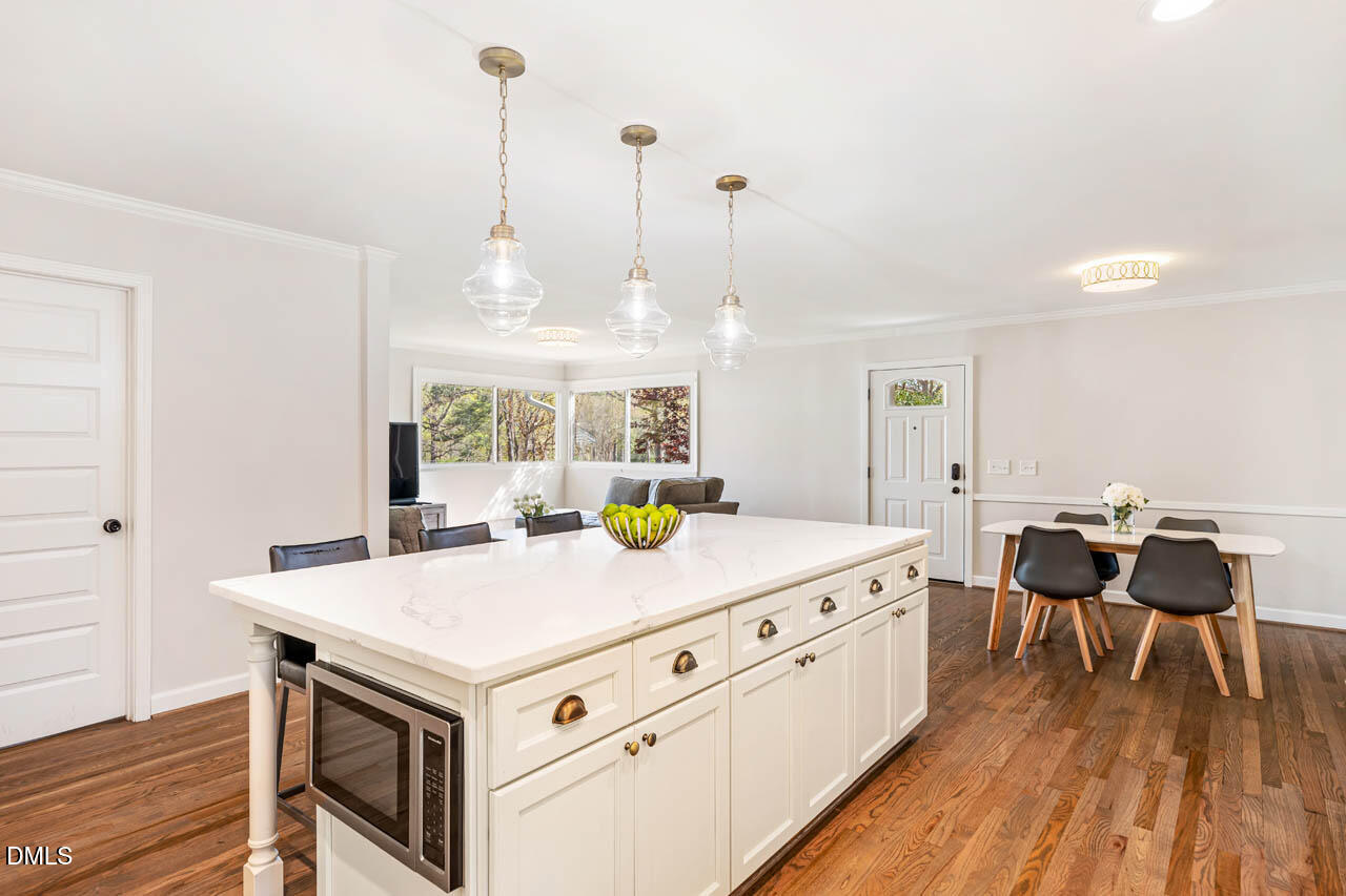 231 Flemington Road Chapel Hill, NC 27517 - Photo 7 of 43 a kitchen that has a stove and a wooden floor
