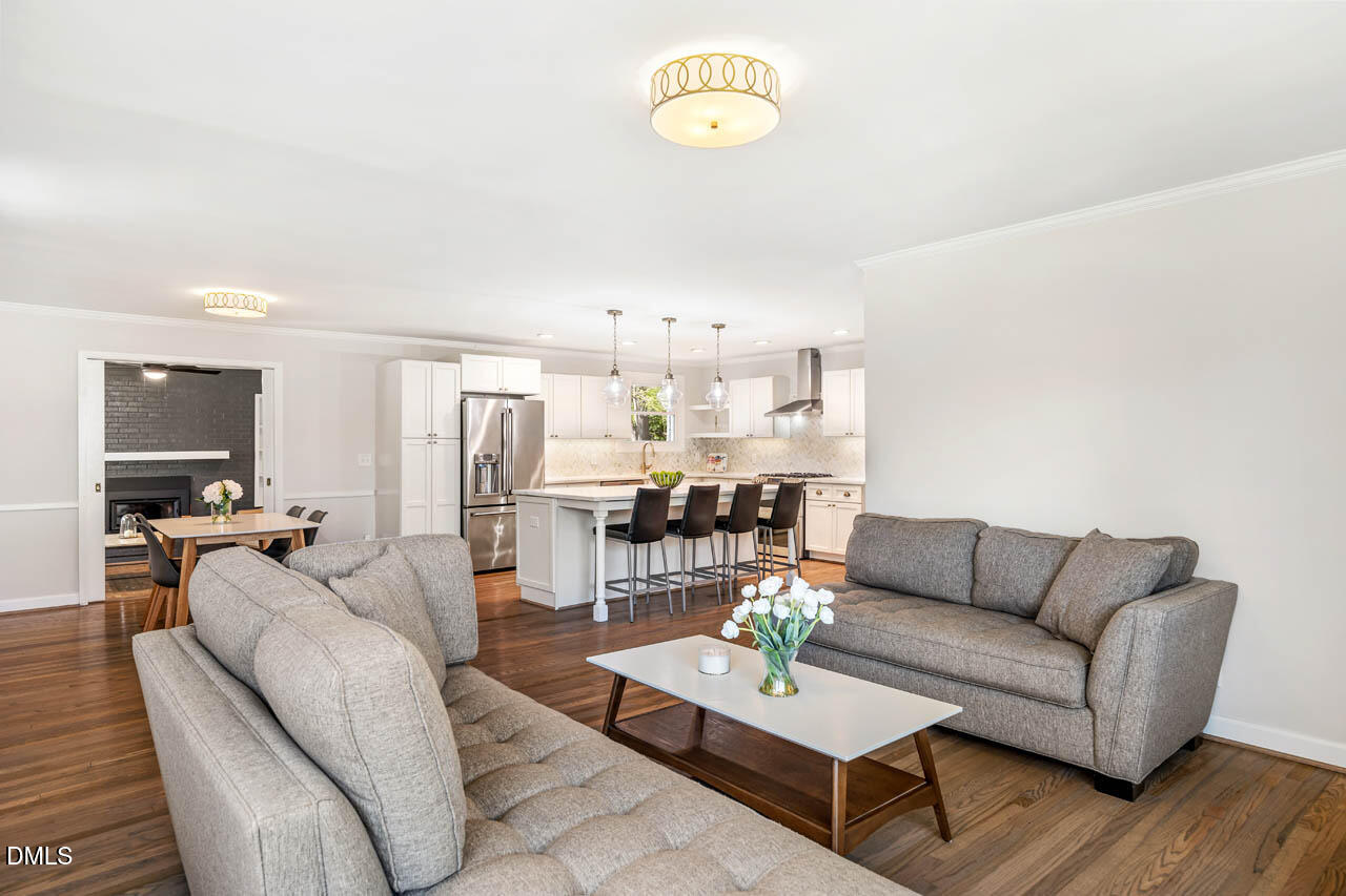 231 Flemington Road Chapel Hill, NC 27517 - Photo 8 of 43 a living room with furniture kitchen view and a wooden floor
