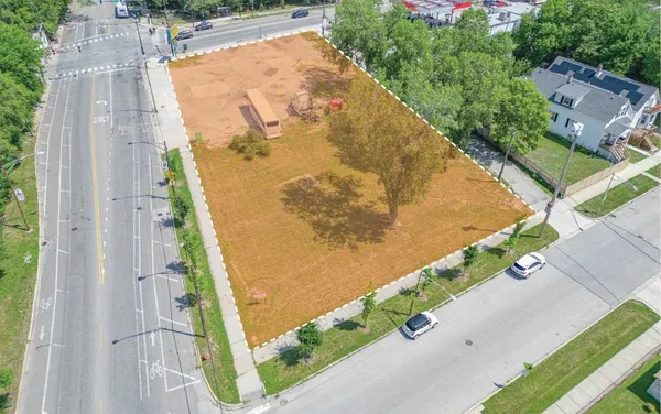 an aerial view of a residential houses with outdoor space