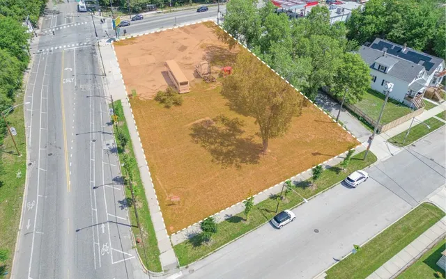 an aerial view of a residential houses with outdoor space