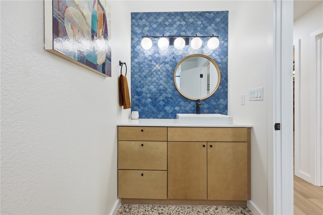 5513 March Street Robstown, TX 78380 - Photo 15 of 26 a bathroom with a mirror and a sink
