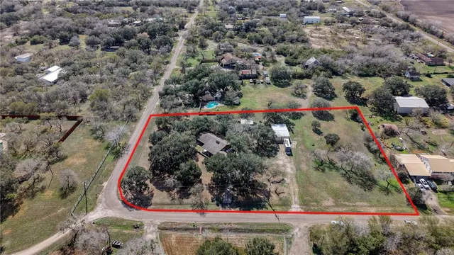 a view of a yard with potted plants