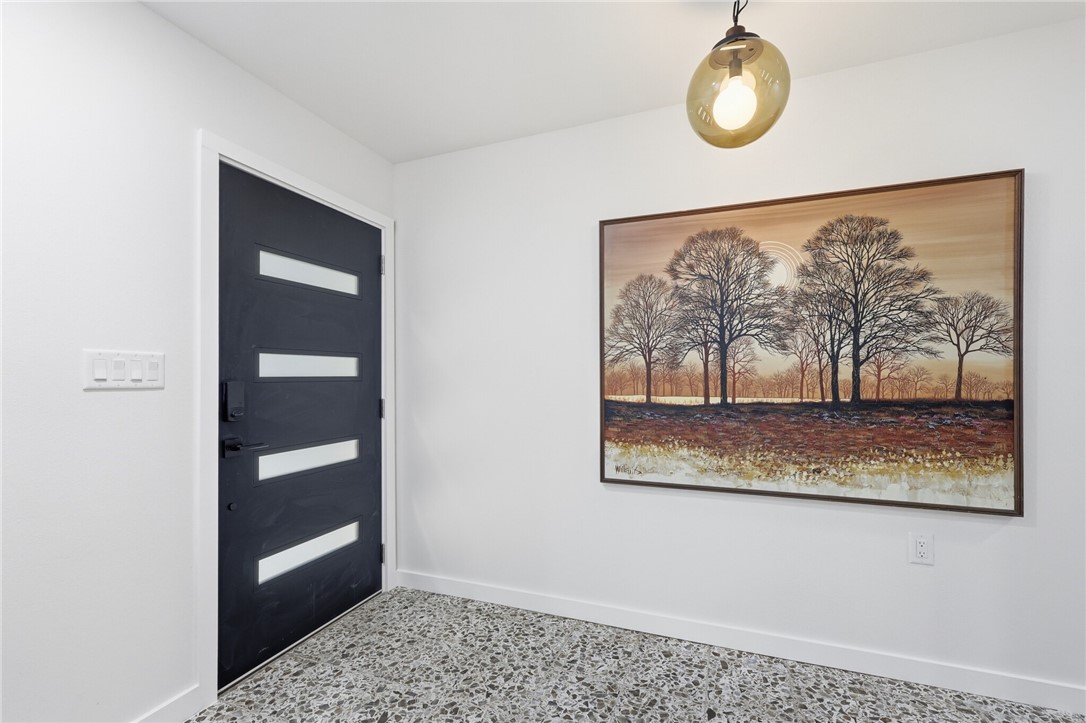 5513 March Street Robstown, TX 78380 - Photo 4 of 26 a view of a hallway with wooden floor and a window