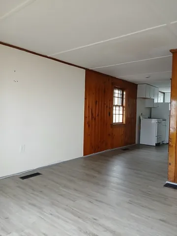 a view of livingroom with furniture and window