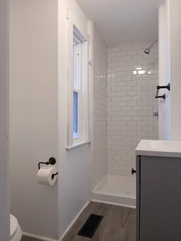 a bathroom with a shower and a toilet