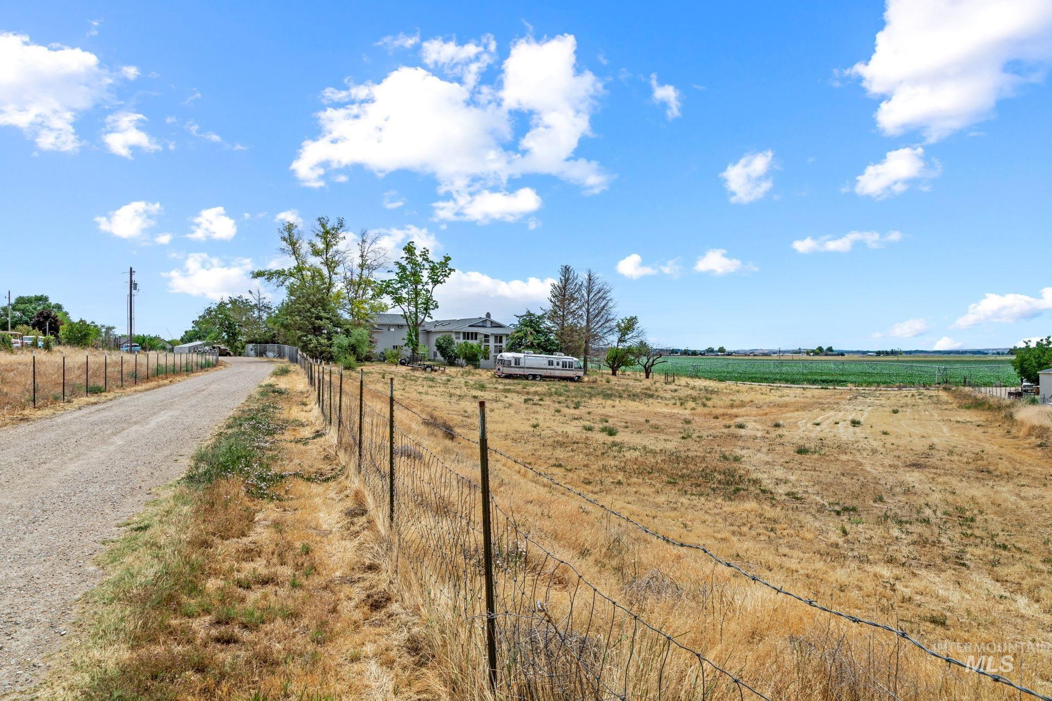 18338 Pride Lane Caldwell, ID 83607 - Photo 49 of 50 Expansive lot featuring a gravel driveway and perimeter fencing