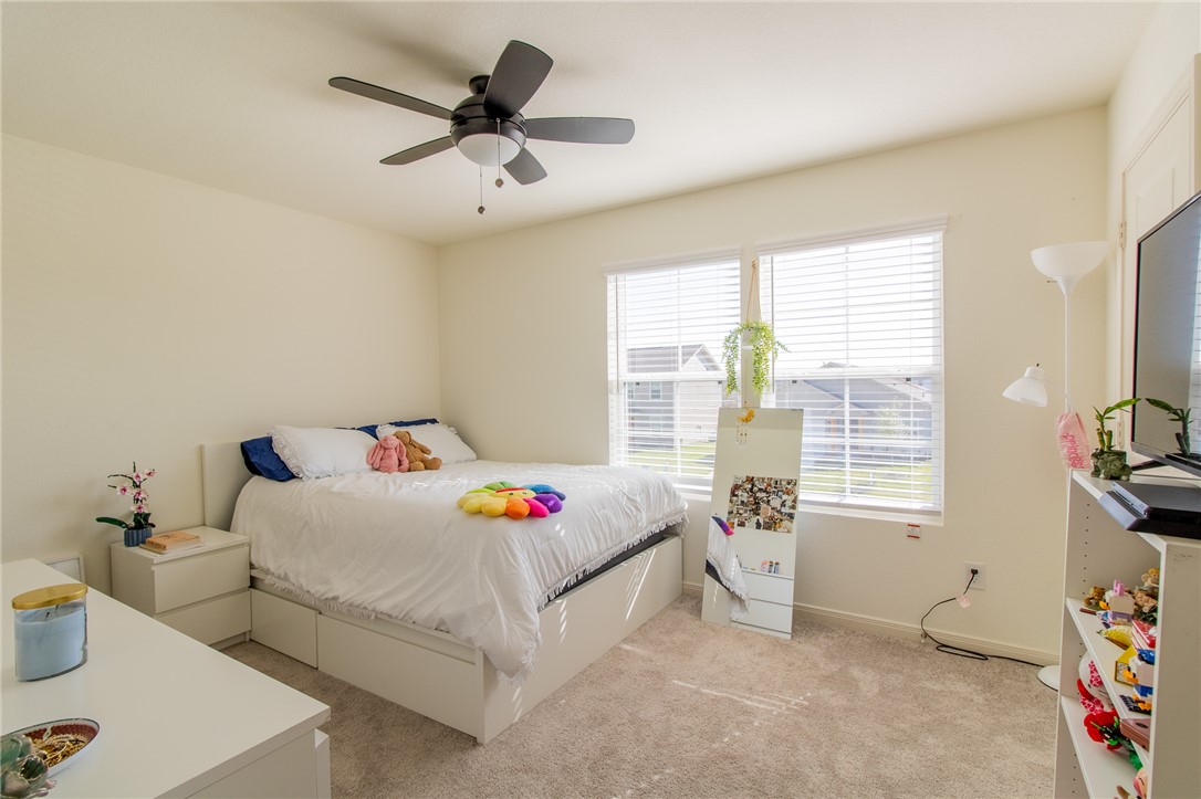 6029 Toby Bend Bryan, TX 77807 - Photo 20 of 25 a bedroom with furniture and window