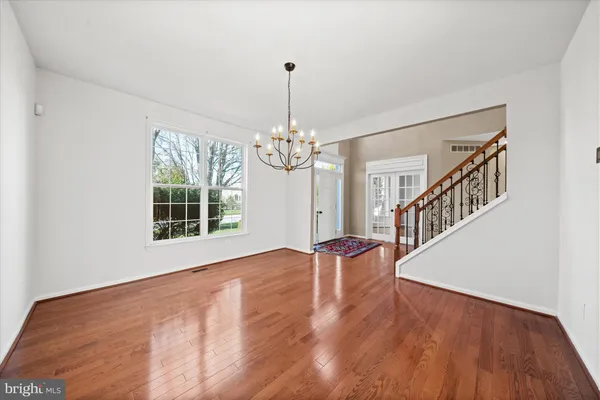 a view of an empty room with windows