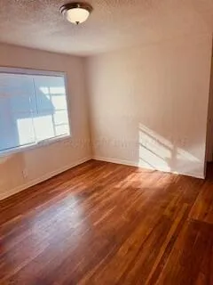 a kitchen with a sink a refrigerator and window