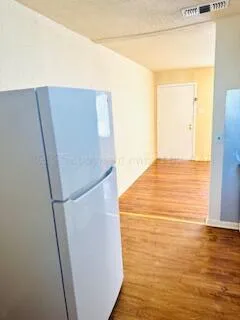 a kitchen with a sink a stove and cabinets
