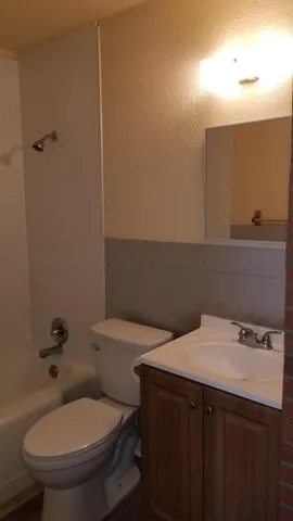 a bath room with a toilet