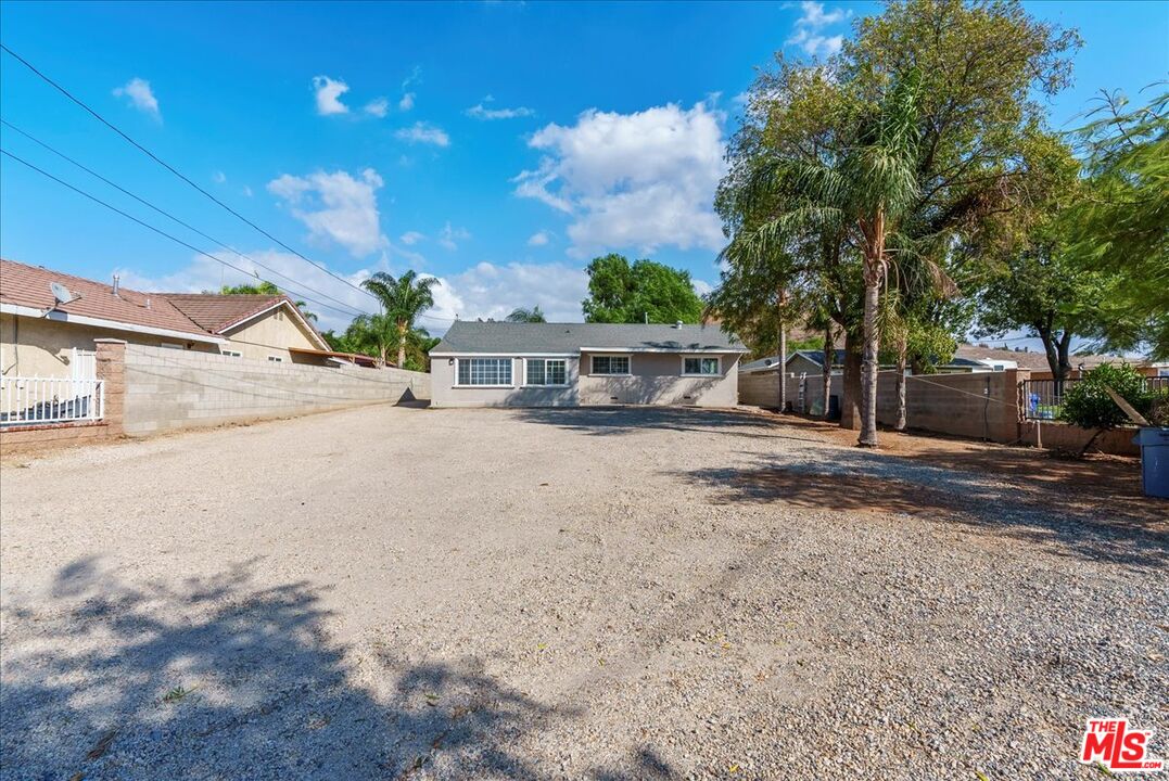 5854 Pedley Road Riverside, CA 92509 - Photo 1 of 36 a view of a house with a road
