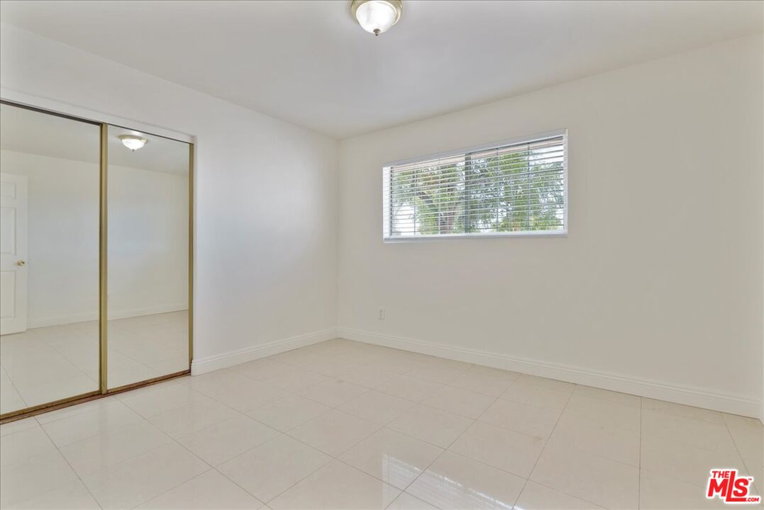 5854 Pedley Road Riverside, CA 92509 - Photo 12 of 36 an empty room with windows