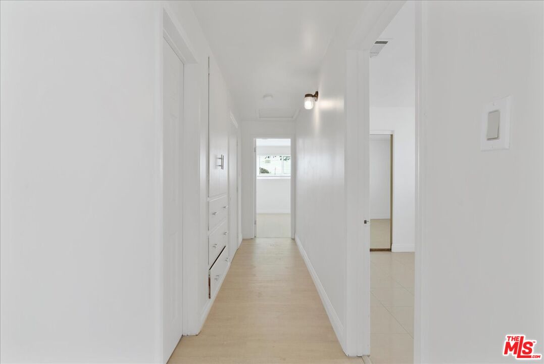 5854 Pedley Road Riverside, CA 92509 - Photo 14 of 36 a view of a bathroom from a hallway