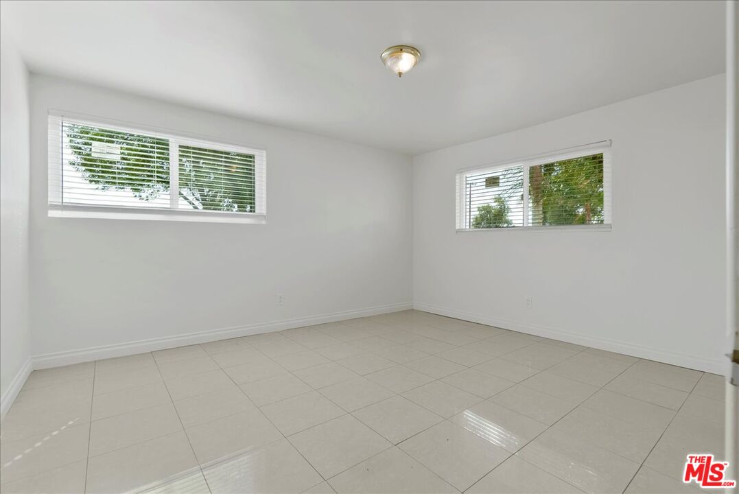 5854 Pedley Road Riverside, CA 92509 - Photo 15 of 36 an empty room with windows