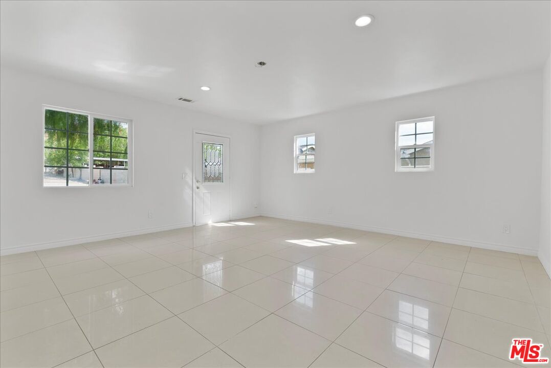 5854 Pedley Road Riverside, CA 92509 - Photo 17 of 36 a view of an empty room with a window