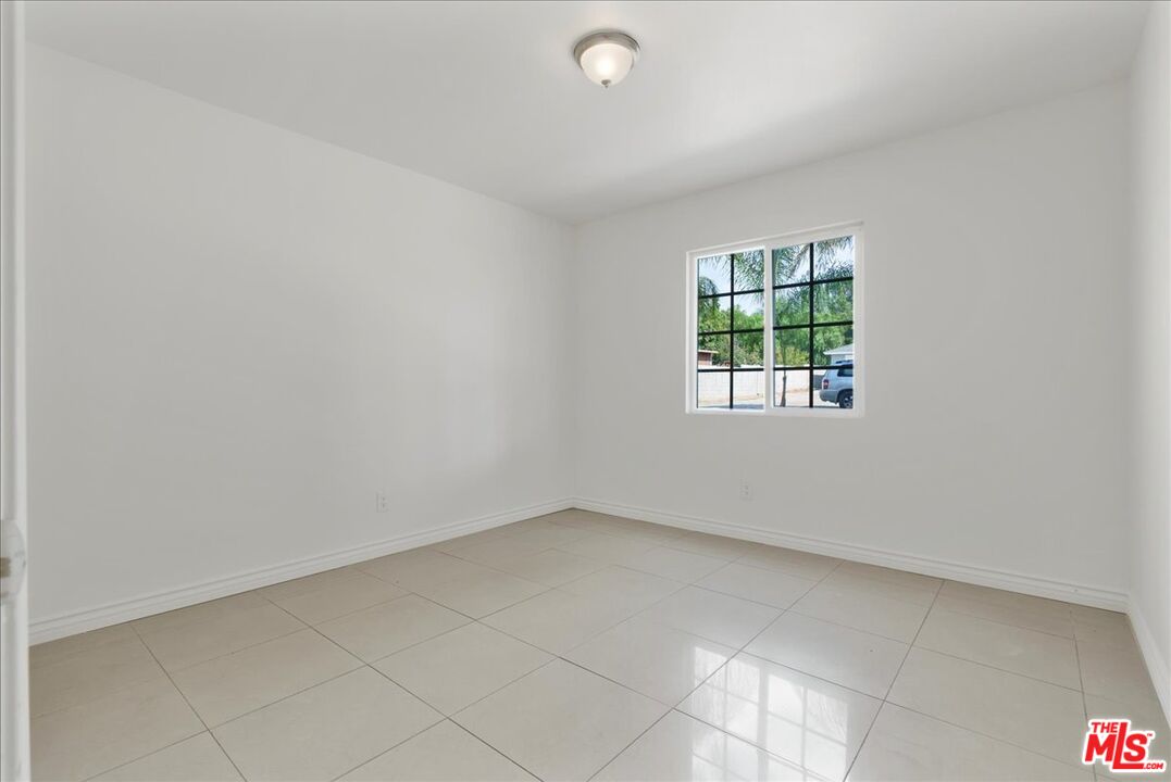 5854 Pedley Road Riverside, CA 92509 - Photo 22 of 36 an empty room with windows