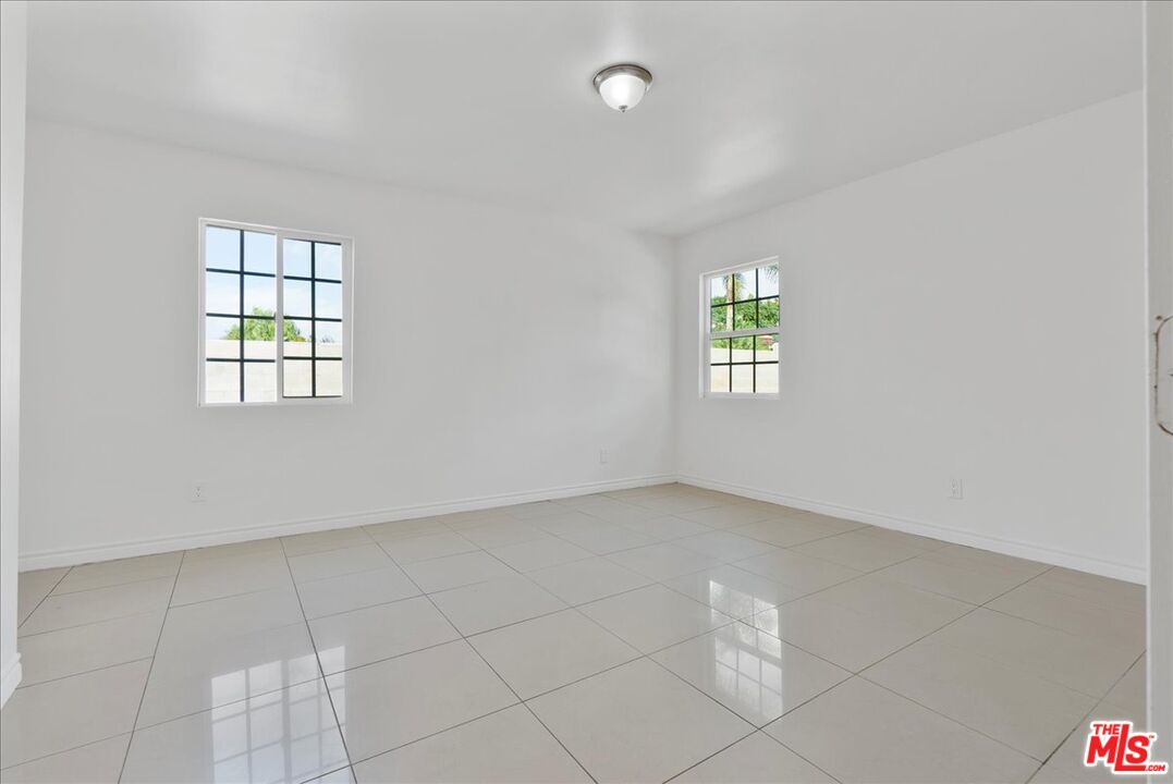 5854 Pedley Road Riverside, CA 92509 - Photo 26 of 36 an empty room with windows