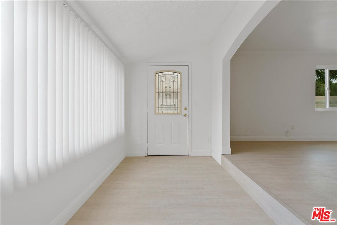 5854 Pedley Road Riverside, CA 92509 - Photo 4 of 36 an empty room with windows