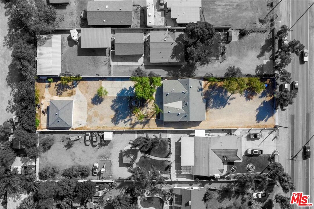 5854 Pedley Road Riverside, CA 92509 - Photo 33 of 36 an aerial view of multiple houses with outdoor space