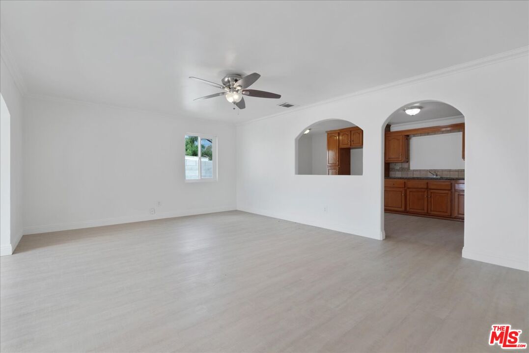 5854 Pedley Road Riverside, CA 92509 - Photo 6 of 36 a view of a big room with windows and cabinet