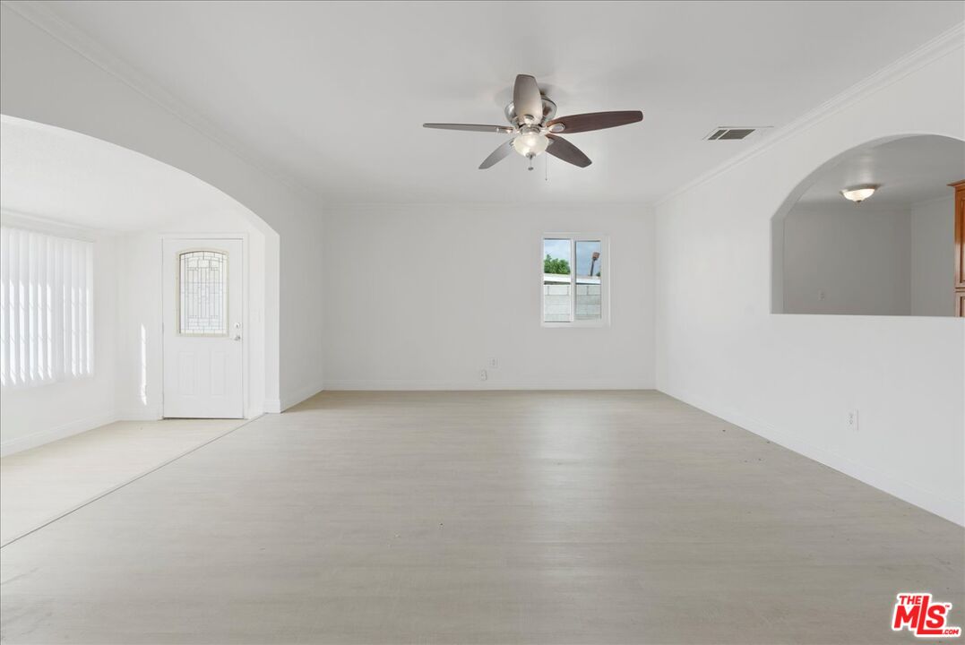 5854 Pedley Road Riverside, CA 92509 - Photo 7 of 36 a view of an empty room with a window