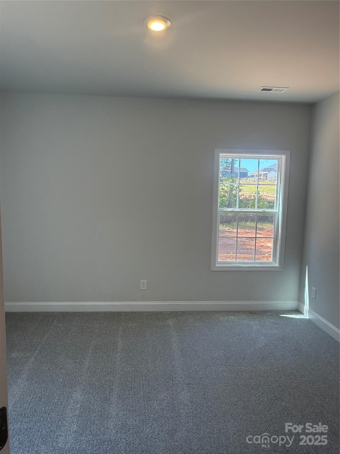 1258 Willow Grove Lane, Unit 101 Clover, SC 29710 - Photo 13 of 39 an empty room with a window