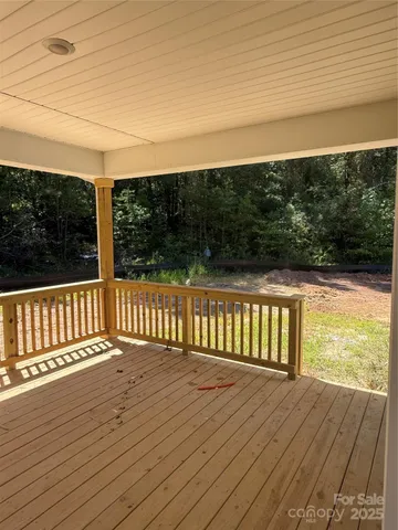 a view of deck with wooden floor and fence