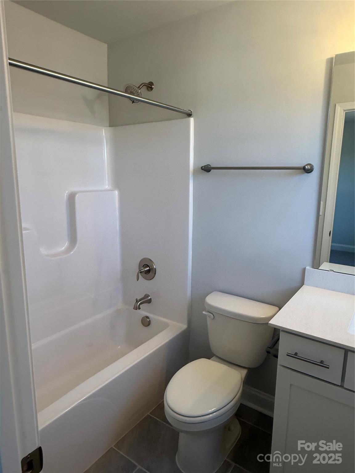 1258 Willow Grove Lane, Unit 101 Clover, SC 29710 - Photo 19 of 39 a white toilet sitting next to a bath tub