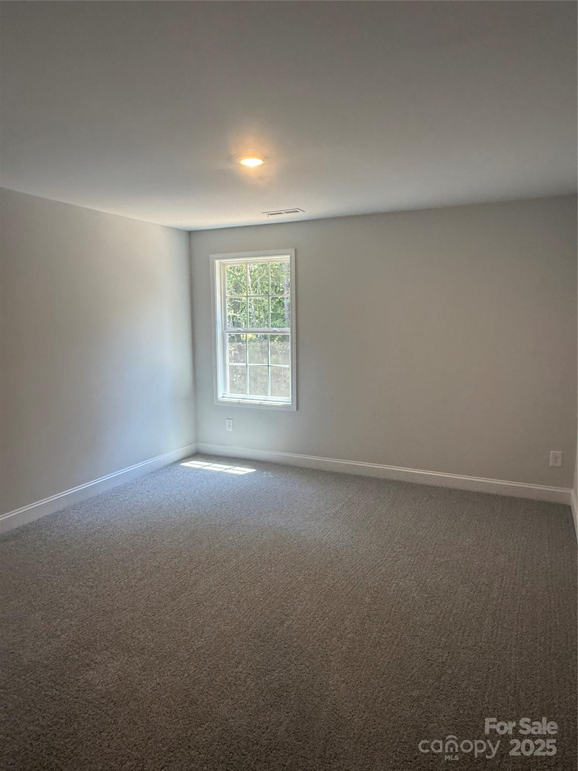 1258 Willow Grove Lane, Unit 101 Clover, SC 29710 - Photo 22 of 39 an empty room with a window