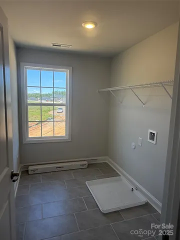 an empty room with a empty space and window