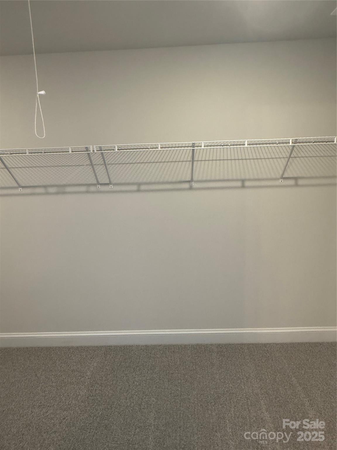 1258 Willow Grove Lane, Unit 101 Clover, SC 29710 - Photo 34 of 39 a view of a room with racks on the wall