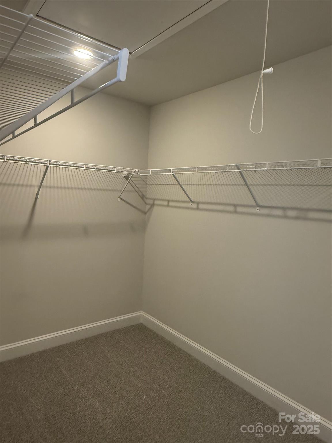 1258 Willow Grove Lane, Unit 101 Clover, SC 29710 - Photo 35 of 39 a view of a room with racks on the wall