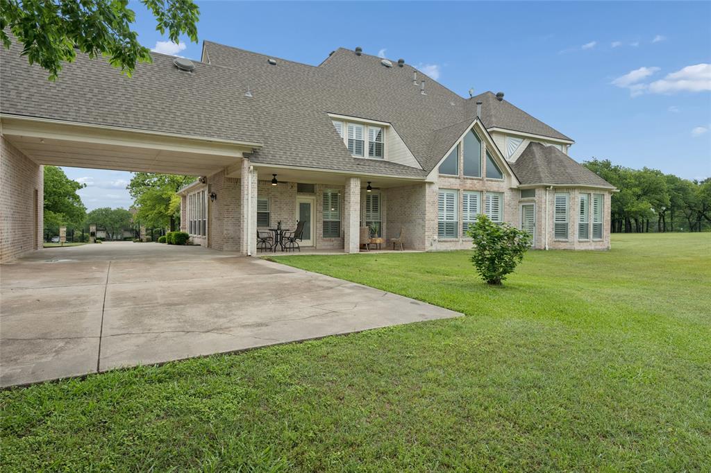 259 King Ranch Court Fort Worth, TX 76108 - Photo 34 of 38 front view of a house with a yard