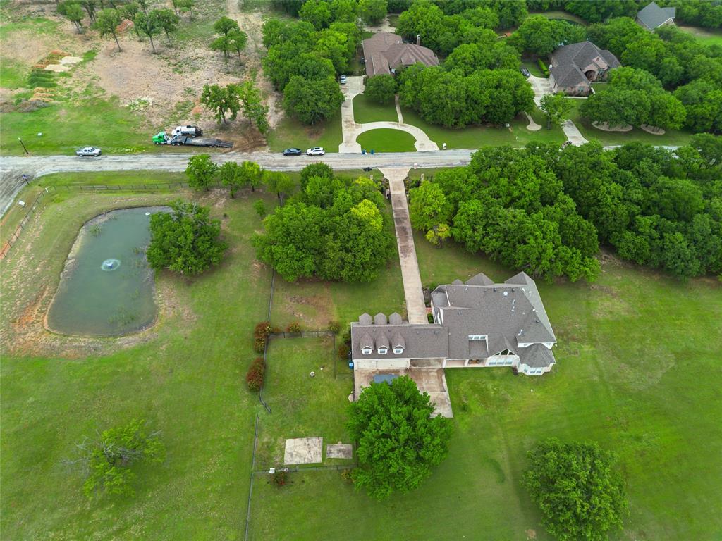 259 King Ranch Court Fort Worth, TX 76108 - Photo 35 of 38 an aerial view of a house with a yard basket ball court and outdoor seating